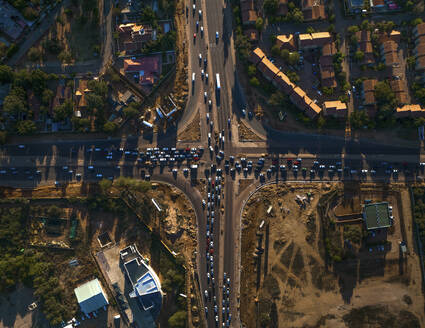 Aerial view of vehicles in a road intersection in Gaborone, Botswana, Africa. - AAEF20950