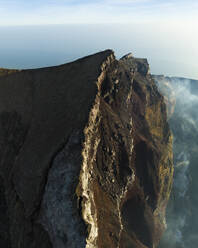 Aerial view of people on top of Mount Agung at sunset, a volcano on Bali Island, Indonesia. - AAEF20959