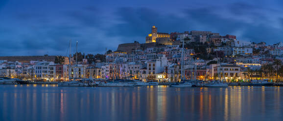 View of Cathedral and Dalt Vila overlooking harbour at dusk, Ibiza Town, Eivissa, Balearic Islands, Spain, Mediterranean, Europe - RHPLF26364