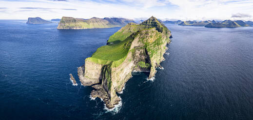 Aerial view of Kallur lighthouse on majestic cliffs washed by the blue Atlantic ocean, Kalsoy island, Faroe Islands, Denmark, Europe - RHPLF26431