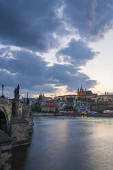 Prague Castle and Charles Bridge on Vltava River in city at twilight, UNESCO World Heritage Site, Prague, Bohemia, Czech Republic (Czechia), Europe - RHPLF26455