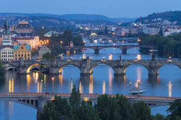 Bridges over Vltava River against sky seen from Letna park at twilight, Prague, Bohemia, Czech Republic (Czechia), Europe - RHPLF26475