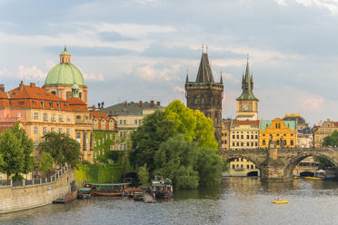 Charles Bridge and Church of Saint Francis of Assisi with Old Town Bridge Tower against sky, UNESCO World Heritage Site, Prague, Bohemia, Czech Republic (Czechia), Europe - RHPLF26489