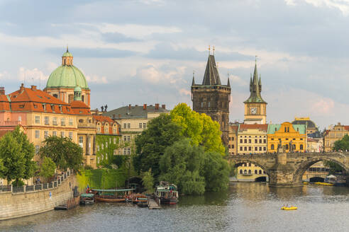 Charles Bridge and Church of Saint Francis of Assisi with Old Town Bridge Tower against sky, UNESCO World Heritage Site, Prague, Bohemia, Czech Republic (Czechia), Europe - RHPLF26489