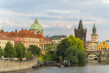 Charles Bridge and Church of Saint Francis of Assisi with Old Town Bridge Tower against sky, UNESCO World Heritage Site, Prague, Bohemia, Czech Republic (Czechia), Europe - RHPLF26490