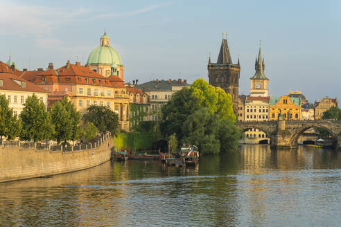 Charles Bridge and Church of Saint Francis of Assisi with Old Town Bridge Tower against sky, UNESCO World Heritage Site, Prague, Bohemia, Czech Republic (Czechia), Europe - RHPLF26491