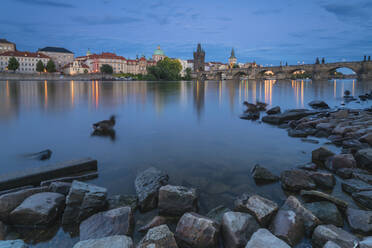 Ducks in Vltava river near Charles Bridge at twilight, Prague, Czech Republic (Czechia), Europe - RHPLF26494