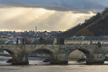 Charles Bridge against dramatic sky, UNESCO World Heritage Site, Prague, Bohemia, Czech Republic (Czechia), Europe - RHPLF26497