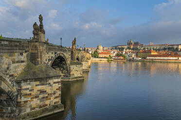 Prague Castle and Charles Bridge on Vltava River at sunrise, UNESCO World Heritage Site, Prague, Bohemia, Czech Republic (Czechia), Europe - RHPLF26509