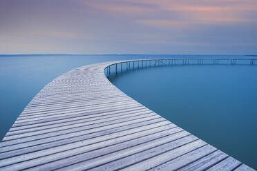 The circle shaped wooden bridge (Infinity Bridge) at dusk, Aarhus, Jutland region, Denmark, Europe - RHPLF26519