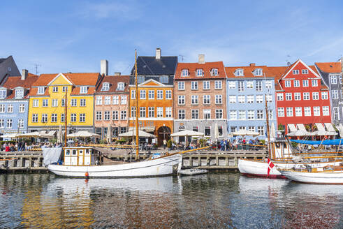 Colorful houses and moored boats in Nyhavn harbour, daytime, Copenhagen, Denmark, Scandinavia, Europe - RHPLF26523