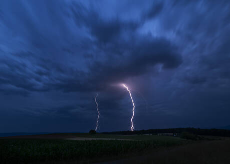 Germany, Baden-Wurttemberg, Long exposure of summer thunderstorm at night - BSTF00237