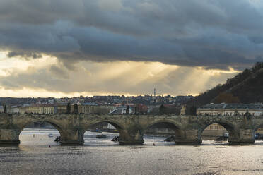 Charles Bridge against dramatic sky, UNESCO World Heritage Site, Prague, Bohemia, Czech Republic (Czechia), Europe - RHPLF26713