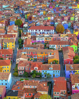 Aerial view of Burano island with colourful building along the lagoon near Venice, Veneto, Italy. - AAEF21011