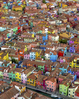 Aerial view of Burano island with colourful building along the lagoon near Venice, Veneto, Italy. - AAEF21012