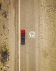 Aerial view of a red car on famous Historical Route 66, California, San Bernardino County, United States. - AAEF21118