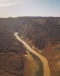 Aerial view of triangular shaped rocks along San Juan River, near Mexican Hat, Utah, United States. - AAEF21141