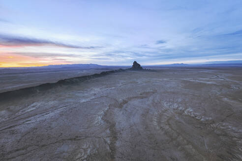 Aerial view of the famous monadnock Shiprock at sunset, Navajo Nation, San Juan County, New Mexico, United States. - AAEF21168