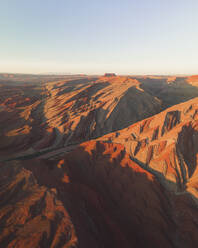 Aerial view of triangular shaped rocks along San Juan River, near Mexican Hat, Utah, United States. - AAEF21185