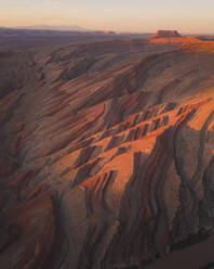 Aerial view of triangular shaped rocks along San Juan River, near Mexican Hat, Utah, United States. - AAEF21189