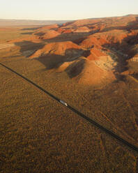 Aerial view of a road near colorful rock textures, near Vermilion Cliffs National Monument, Marble Canyon, Arizona, United States. - AAEF21279