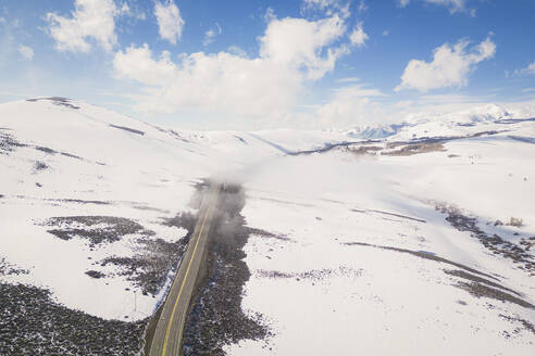 Aerial view of the snowy road leading to Conway Summit, California, United States. - AAEF21321