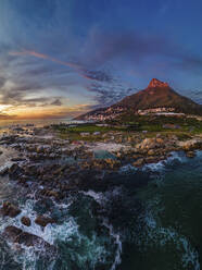 Panoramic aerial view of Maiden’s Cove Tidal Pool at sunset with Lions Head mountain, Cape Town, South Africa. - AAEF21416