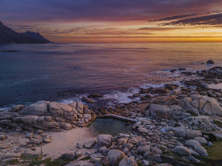 Aerial view of Maidens Cove tidal pool at sunset with Atlantic Ocean in background, Cape Town, South Africa. - AAEF21423