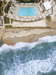 Aerial view of a swimming pool next to the beach in St Augustine Beach, Florida, United States. - AAEF21482