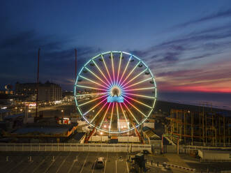 Aerial view of a ferris wheel before sunrise in Ocean City, Maryland, United States. - AAEF21502
