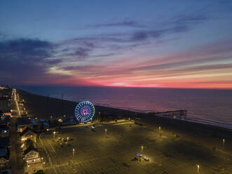 Aerial view of the beach, pier and ferris wheel before sunrise in Ocean City, Maryland, United States. - AAEF21503