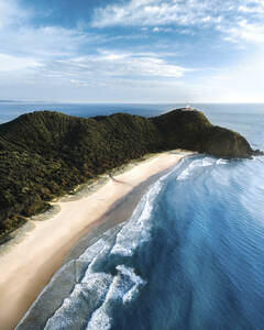 Aerial view of Byron Bay beautiful beach with white sand along the Ocean, New South Wales, Australia. - AAEF21520