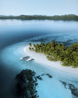 Aerial view of Catamarans docked along the shoreline on Pass Island, Coron, Palawan, Philippines. - AAEF21530