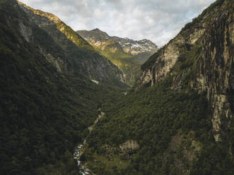 Aerial drone view of the valley on top of the Foroglio waterfall in Valmaggia, Maggia, Switzerland. - AAEF21600