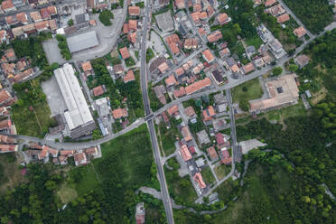 Aerial view of a road crossing a residential district on the mountain valley in Serino, Irpinia, Avellino, Campania, Italy. - AAEF21635