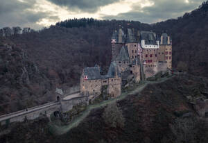 Aerial view of Eltz castle, a medieval fort nestled in the hills near Koblenz and Trier, Germany. - AAEF21743