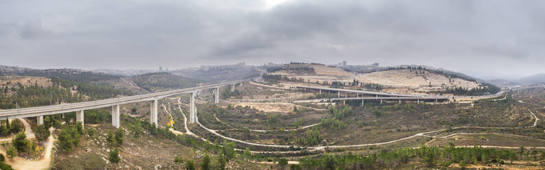 Aerial view of a concrete train bridge leading to a city, Jerusalem, Israel. - AAEF21757