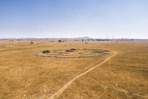 Aerial view of ancient megalithic monument site in the shape of 3 concentric stone circles, Rujum Al-Hiri, Golan Heights, Israel. - AAEF21767