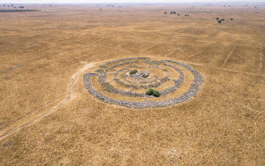 Aerial view of ancient megalithic monument site in the shape of 3 concentric stone circles, Rujum Al-Hiri, Golan Heights, Israel. - AAEF21768