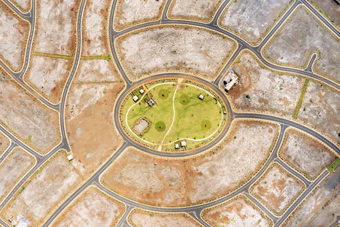 Aerial drone view of a construction site with roundabout streets, Flic en Flac, Black River, Mauritius. - AAEF21799