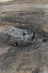 Aerial view of a Land fill machinery moving debris from one location to another, Australia. - AAEF21836