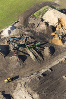 Aerial view of cranes sorting materials ready for dispatch to customers awaiting their orders, near Melbourne, Victoria, Australia. - AAEF21840