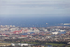 Aerial view of the Port of Melbourne along the ocean coastline, Melbourne, Victoria, Australia. - AAEF21854