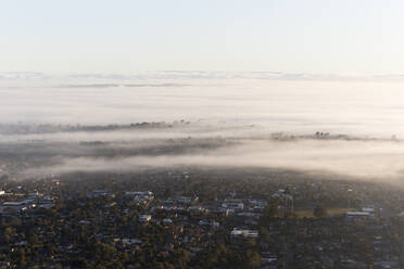 Aerial view of Melbourne residential district with morning fog, Victoria, Australia. - AAEF21882