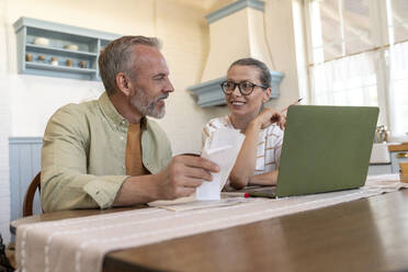 Man and woman preparing financial bills at home - VPIF08386