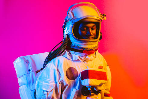 Cinematic image of an astronaut. Colorful portrait of a man with spacesuit - DMDF01758