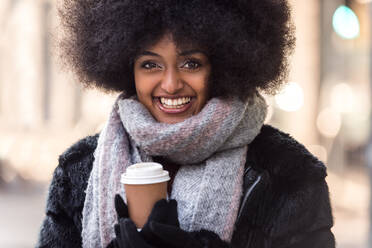 Beautiful woman drinking hot coffee - Afroamerican girl portrait outdoors - DMDF02011