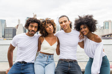 Group of afroamerican friends bonding in Manhattan, New York - Young adults having fun outdoors, concepts about lifestyle and young adult generation - DMDF02022