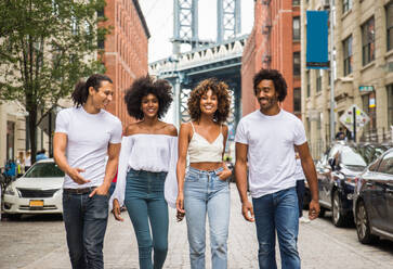 Group of afroamerican friends bonding in Manhattan, New York - Young adults having fun outdoors, concepts about lifestyle and young adult generation - DMDF02030