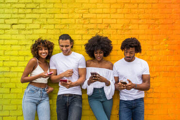 Group of afroamerican friends bonding in Manhattan, New York - Young adults having fun outdoors, concepts about lifestyle and young adult generation - DMDF02035